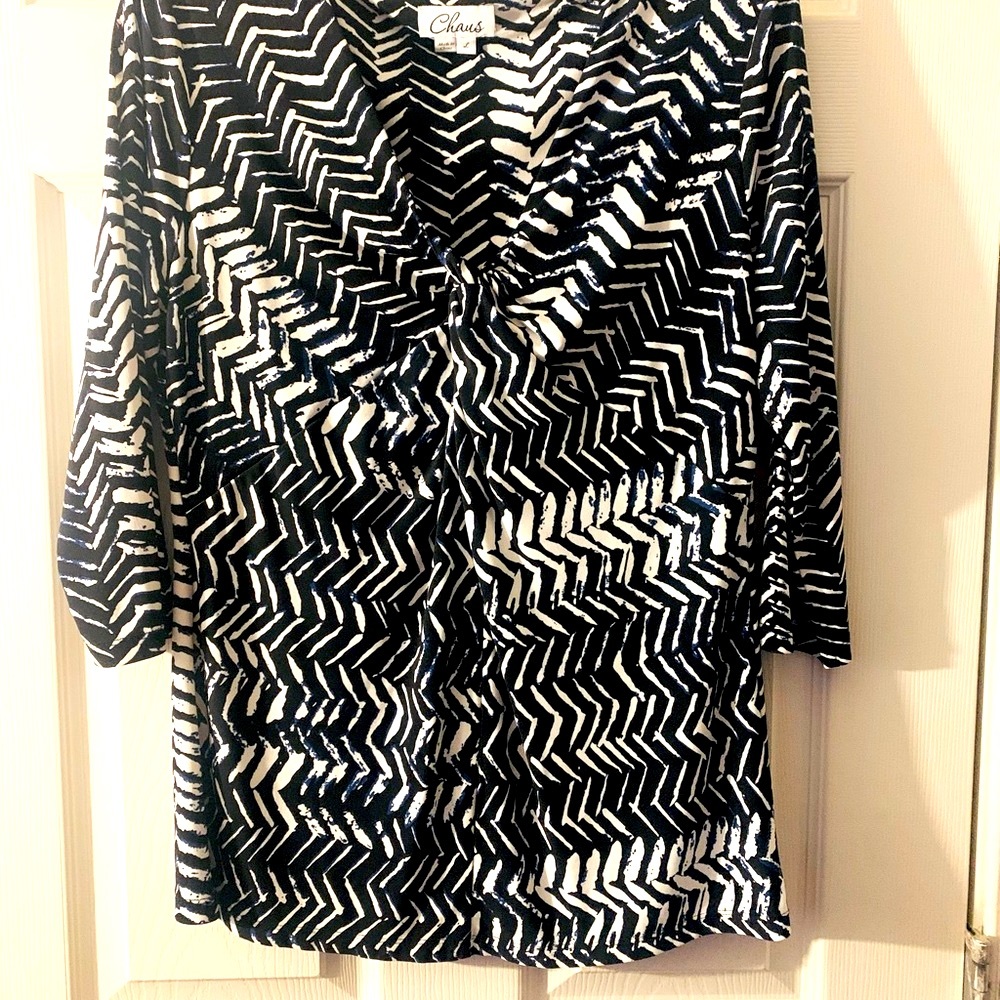 Woman’s black & white Top with a splash of blue.